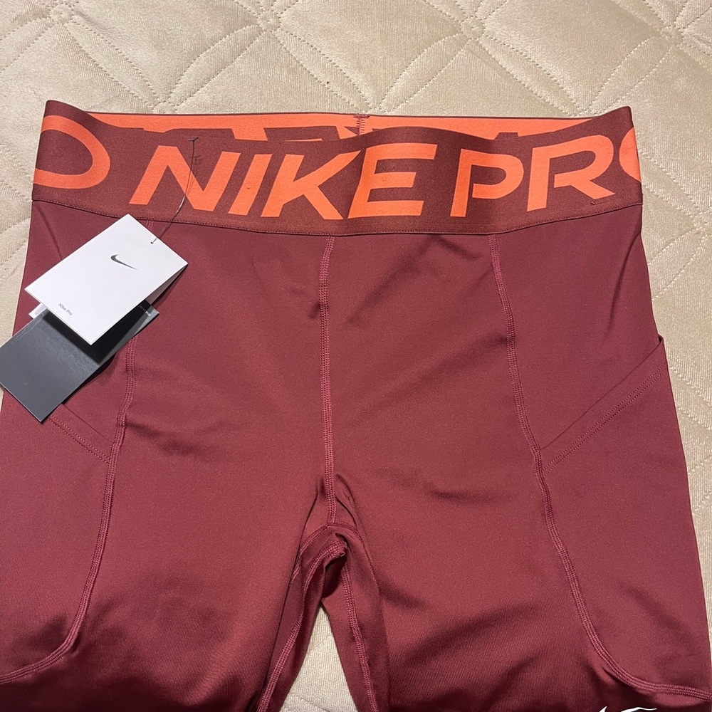 Nike Pro Dri-FIT Leggings in Maroon and Orange